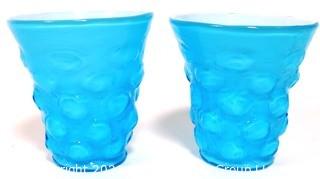 Pair of Blue Hand Blown Glass Beakers Encased In White Made by the Consolidated Glass Co. Measures approximately 5" tall.