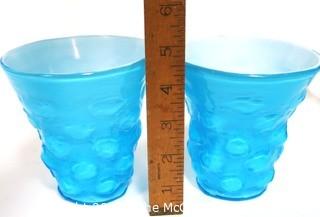 Pair of Blue Hand Blown Glass Beakers Encased In White Made by the Consolidated Glass Co. Measures approximately 5" tall.