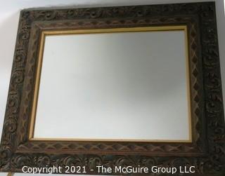 Wide Carved Wood Framed Wall Mirror.  Measures approximately 19" x 16".