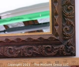 Wide Carved Wood Framed Wall Mirror.  Measures approximately 19" x 16".