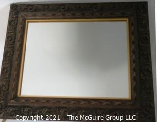 Wide Carved Wood Framed Wall Mirror.  Measures approximately 19" x 16".