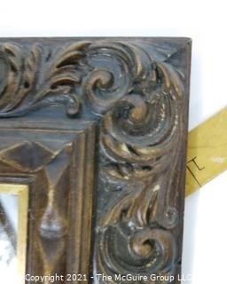 Wide Carved Wood Framed Wall Mirror.  Measures approximately 19" x 16".