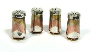 Taxco Mexico Sterling Silver Metales Casados JHP Mixed Metals Salt & Pepper Shakers.  Made of Copper, Brass and Sterling Silver.  They measure approximately 1 3/4" tall. 