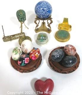 Assortment of Decorative Items Including Paperweights and Pysanky Carved Wooden Eggs