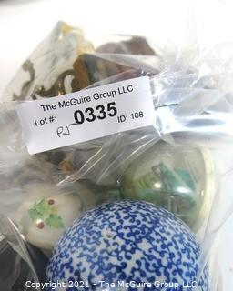 Assortment of Decorative Items Including Paperweights and Pysanky Carved Wooden Eggs