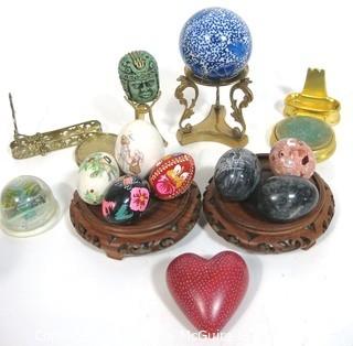 Assortment of Decorative Items Including Paperweights and Pysanky Carved Wooden Eggs