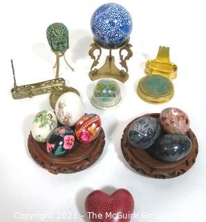 Assortment of Decorative Items Including Paperweights and Pysanky Carved Wooden Eggs