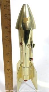 Vintage Astro Berzac Rocket Ship Mechanical Coin Bank.  Measures approximately 11" tall.