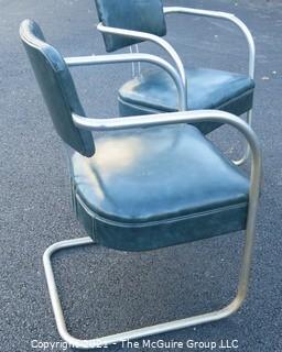 Pair of Vintage Mid Century Modern Chrome with Green Vinyl Chairs.  