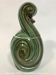 Vintage Mid Century Modern Flourish Shaped Pottery Cookie Jar or Canister.  It measures approximately 12" tall.