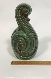 Vintage Mid Century Modern Flourish Shaped Pottery Cookie Jar or Canister.  It measures approximately 12" tall.