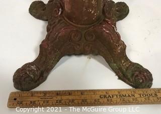 Cast iron Red Painted Stand.  Measures approximately 24" tall.