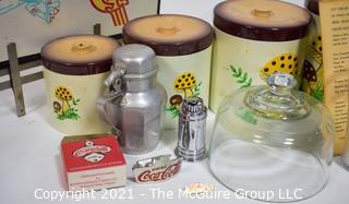 Collection including vintage diner menus, Coca Cola, Aluminum Karo Syrup container, and glass cloche and nesting set of canisters 