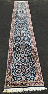 Hand Woven & Knotted Runner on Blue Ground.  Measures approximately 2'4" x 18'8".