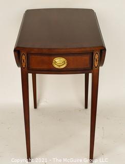 Sheraton Style Pembroke Mahogany Drop Leaf Table with Satinwood Inlay, made by Councill;  25"T and extends to 29"W with leaves up.