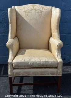 Yellow Damask Upholstered Wing Back Chair. {Note: repaired leg}