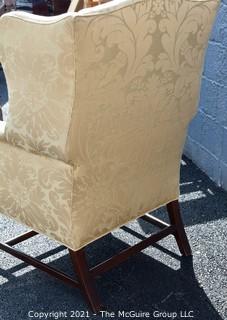 Yellow Damask Upholstered Wing Back Chair. {Note: repaired leg}