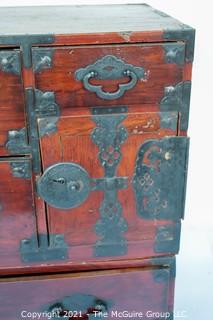 Asian Tansu Chest on Chest with Bronze Hardware.  Some damage to drawers and back.  WE HAVE NO MEASUREMENTS FOR THIS 