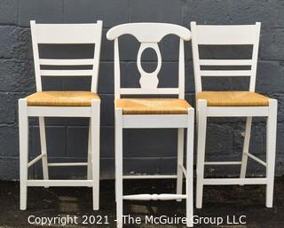 Set of Three White Lacquer and Rush Seat Bar Stools. 