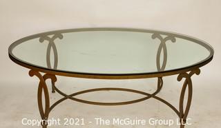 Oval Heavy Gilt Cast Iron Coffee Table with Glass Insert.  Measures approximately 49"long x 34" wide