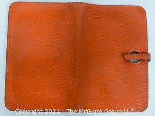 Authentic Hermes Togo Dogon Duo Wallet in Orange Abricot.  