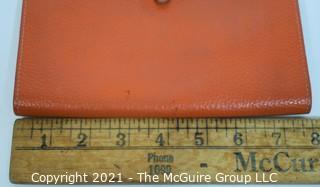 Authentic Hermes Togo Dogon Duo Wallet in Orange Abricot.  