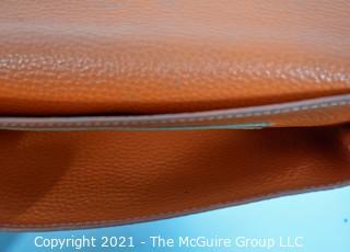 Authentic Hermes Togo Dogon Duo Wallet in Orange Abricot.  