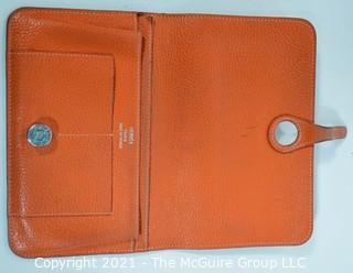 Authentic Hermes Togo Dogon Duo Wallet in Orange Abricot.  