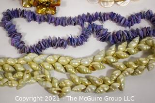 Four Shell and Mother of Pearl Beaded Necklaces.