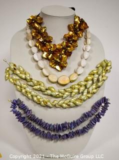 Four Shell and Mother of Pearl Beaded Necklaces.