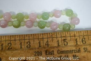 Pink Quartz & Green Stone or Jade Beads with Carved Seahorse Catch Necklace.   Measures approximately 32" long. 