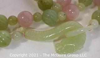 Pink Quartz & Green Stone or Jade Beads with Carved Seahorse Catch Necklace.   Measures approximately 32" long. 