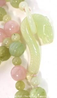 Pink Quartz & Green Stone or Jade Beads with Carved Seahorse Catch Necklace.   Measures approximately 32" long. 