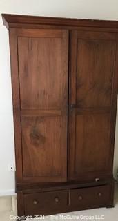 Two piece armoire with original hardware. (Note the repurposed stenciled wood). 45 1/2" W x 20"D x 81"T 