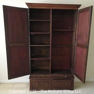 Two piece armoire with original hardware. (Note the repurposed stenciled wood). 45 1/2" W x 20"D x 81"T 