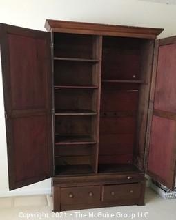 Two piece armoire with original hardware. (Note the repurposed stenciled wood). 45 1/2" W x 20"D x 81"T 