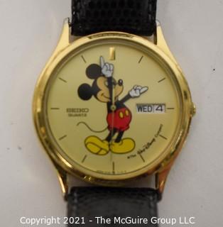 Gold Walt Disney Mickey Mouse Wrist Watch made by Seiko with Black Band.  Untested.