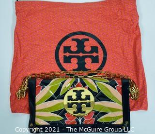 Tory Burch Floral Print Patent Leather Folding Clutch with Chain Strap & Navy Blue Interior.  Measures approximately 12"L x 1"W x 7"H. Comes with its original Tory Burch cloth storage bag.
