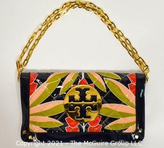 Tory Burch Floral Print Patent Leather Folding Clutch with Chain Strap & Navy Blue Interior.  Measures approximately 12"L x 1"W x 7"H. Comes with its original Tory Burch cloth storage bag.
