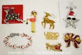 Collection of Christmas Jewelry Including Rhinestone Brooches. 