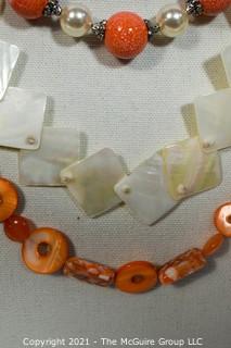 Three (3) Beaded Necklaces in Orange & White Mother of Pearl.
