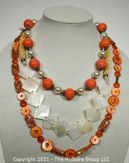 Three (3) Beaded Necklaces in Orange & White Mother of Pearl.
