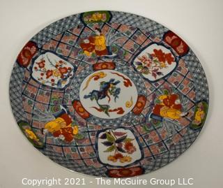 Porcelain Asian Stamped Hand Painted Charger or Plate. Measures approximately 16" in diameter.