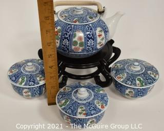 Porcelain Asian Stamped Hand Painted Tea Pot and 3 Tea Cups with Lids. 