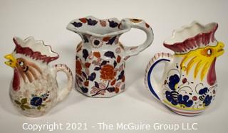 Three water pitchers: Italian rooster (hand painted Deruta; oriental motif; and Italian rooster (Nordstrom)