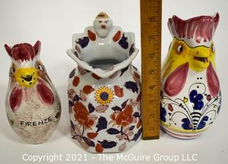 Three water pitchers: Italian rooster (hand painted Deruta; oriental motif; and Italian rooster (Nordstrom)