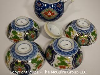 Porcelain Asian Stamped Hand Painted Tea Pot and 4 Tea Cups.