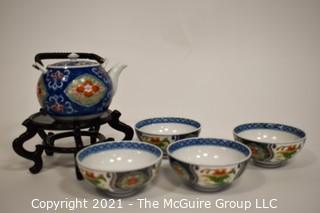 Porcelain Asian Stamped Hand Painted Tea Pot and 4 Tea Cups.