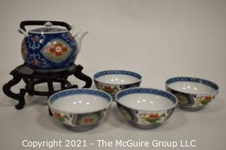 Porcelain Asian Stamped Hand Painted Tea Pot and 4 Tea Cups.