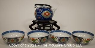 Porcelain Asian Stamped Hand Painted Tea Pot and 4 Tea Cups.